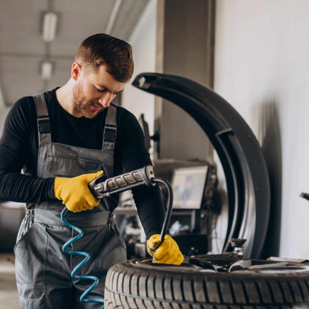 car-mechanic-changing-wheels-car-1-scaled